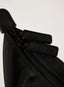 Black bag with 'DES VU' branding on a white background