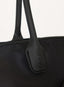 Black handbag with a visible brand logo on a white background