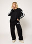 Oversized black long sleeve top with white DÈSVU 422 logo on both sleeves-3
