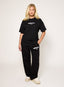 Black oversized joggers with white embroidered DÈSVU 422 logo on hip-5