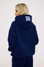 Navy blue hoodie with leopard print on a white background
