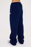 Navy blue sweatpants with a DÈS VU leopard logo on a white background
