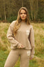 The image shows the Dès Vu Farmhouse Knitted Trousers and Jumper in colour Taupe