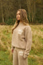 The image shows the Dès Vu Farmhouse Knitted Trousers and Jumper in colour Taupe