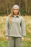 The image shows the Dès Vu Farmhouse Collection Polo Jumper and Wide Leg Joggers in colour Olive