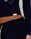 Close up of yellow 422 tag on waistband of the navy zip up.