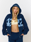 Woman wearing navy hoodie with '422' branding on a white background.