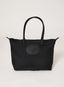 Black tote bag with a visible brand logo on a white background