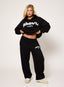 Black oversized joggers with white embroidered DÈSVU 422 logo on hip-2