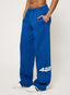 Blue sweatpants with '422' printed on them worn by a person on a white background