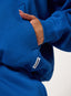 Blue sweatshirt with a brand logo on a white background