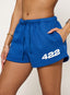 Blue shorts with '422' printed on them worn by a person.