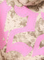 Pink decorative elements with rhinestones on a camouflage background