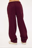 burgundy joggers on a white background