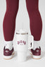 Image of Dès Vu Leggings and Socks and close up of the white Dès Vu water bottle