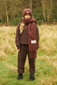 The image shows the Dès Vu Farmhouse Collection Knitted Scarf in colour Chocolate