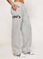 Grey joggers with 422 DÈS VU logo  on a plain background