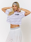 Woman wearing purple striped t shirt with '422' branding on a white background.