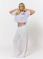 Woman wearing purple striped t shirt with '422' branding on a white background.
