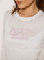 Closeup of white sheer long sleeve t-shirt with '422' branding on a white background.