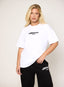 Model wearing oversized white 422 DÈSVU logo t-shirt with black embroidery-1